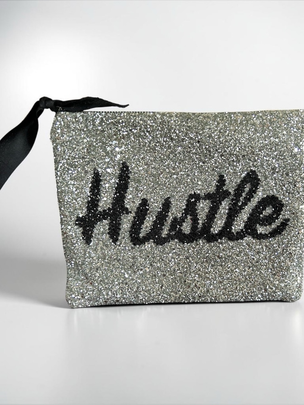 Y2K Lisa Bea large glitter zipper ‘Hustle” pouch.  Purchased in the U.K.